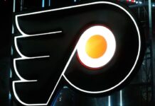 Guy Gaudreau, father of John and Matthew, helps out at Flyers practice