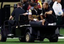Saints CB Paulson Adebo carted off with knee injury