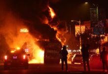 12 arrested, L.A. bus set on fire following World Series win